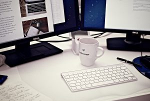 Computer workstation with keyboard and coffee cup