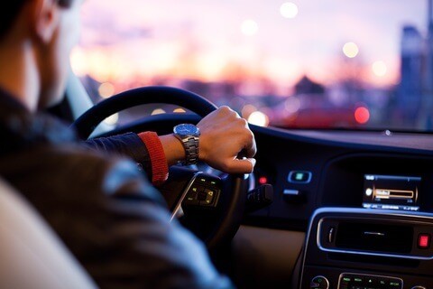 Man driving a nice car and he looks relaxed