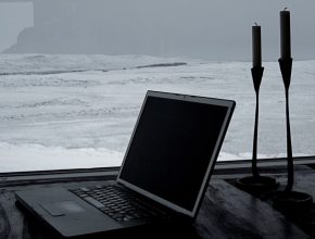 Laptop sitting at the beach